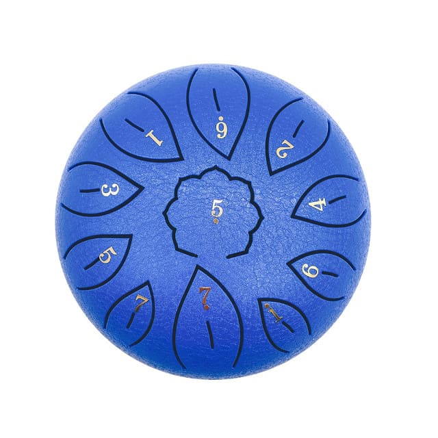 Tongue drum enfant posé sur une table d'école en bois clair