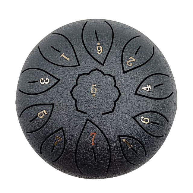 Tongue drum enfant compact 15 cm tenu dans une petite main