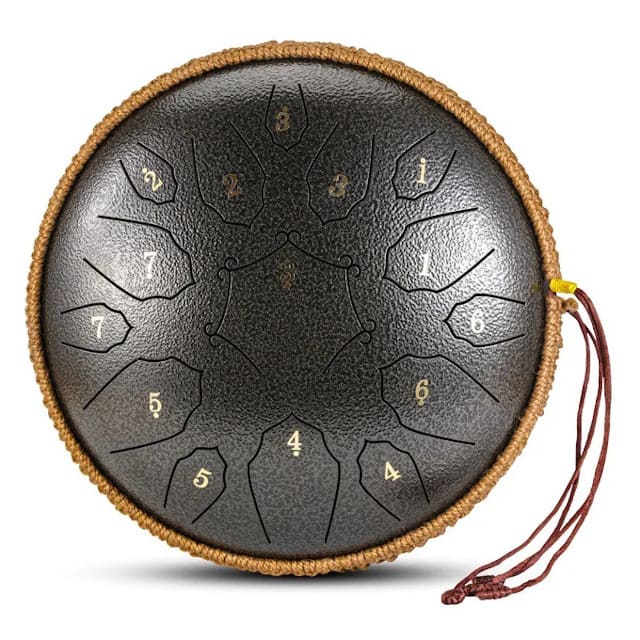 Tongue drum à résonance longue posé sur un tapis de yoga
